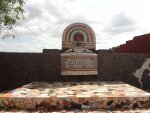 A sculpture of Theyyam, made of tile pieces