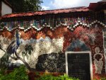 The exterior wall of the Rock Garden, Malampuzha. Note the bangles hanging on top.